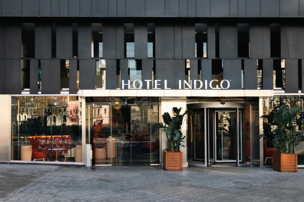 "Hotel Indigo entrance with modern architectural design in Barcelona"