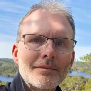 A close-up headshot of Christer Ahlström